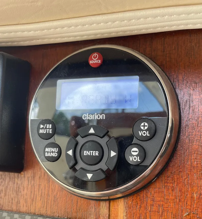 Slide: The Image of Clarion audio control panel on 1967 Hatteras 28 Cruiser boat dashboard. - 51