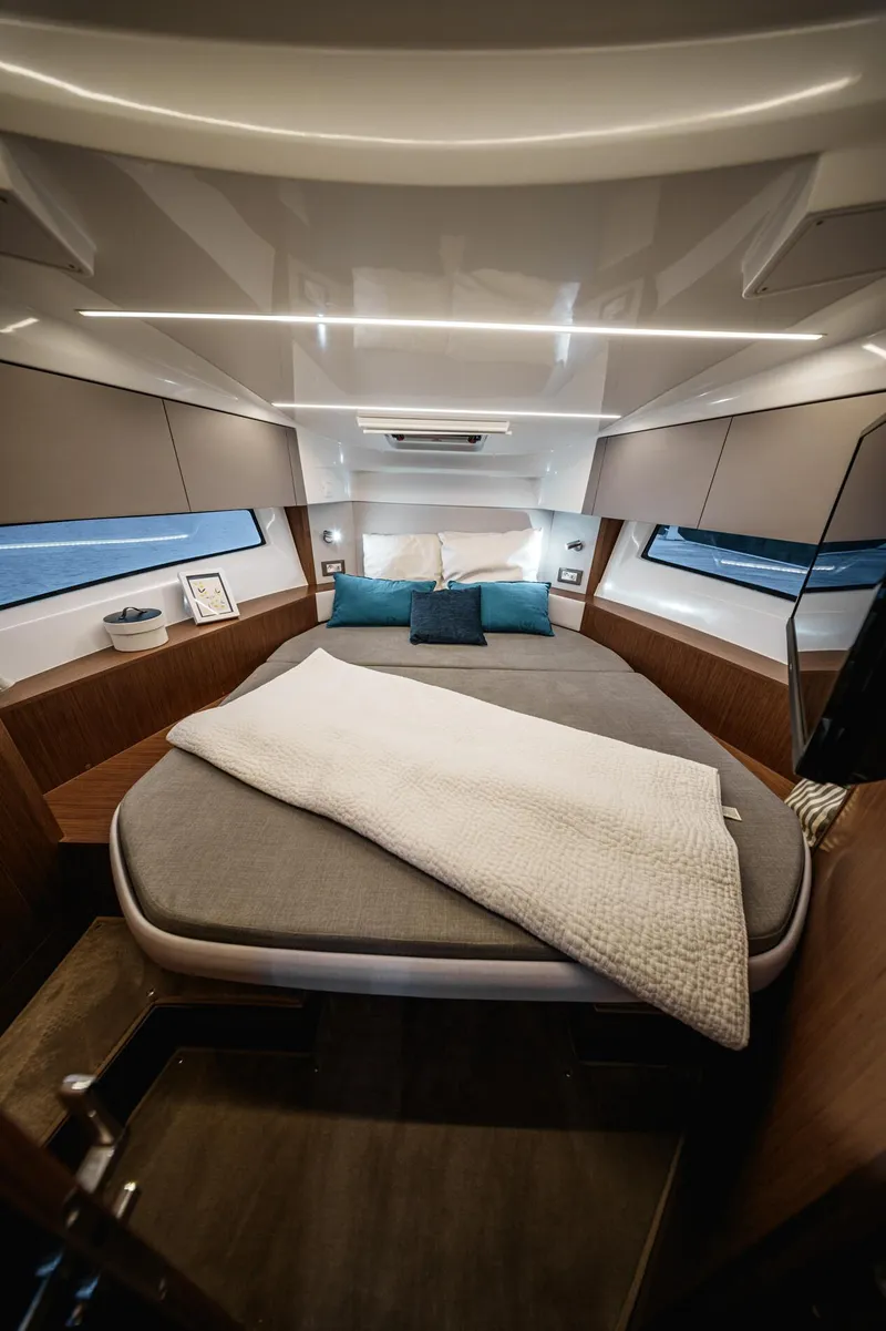 Slide: The Image of Luxurious cabin interior of 2025 Beneteau Antares 9 with modern design and cozy bedding. - 13