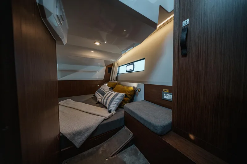 Slide: The Image of 2025 Beneteau Antares 9 cabin interior with cozy bed and modern design. - 20