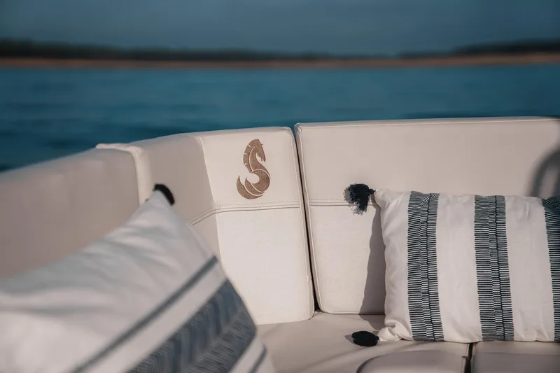 Slide: The Image of Beneteau Antares 9 2025 boat interior with stylish cushions and embroidered logo. - 38