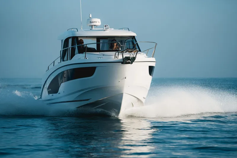 Slide: The Image of 2025 Beneteau Antares 9 cruising on open water, showcasing sleek design and performance. - 6