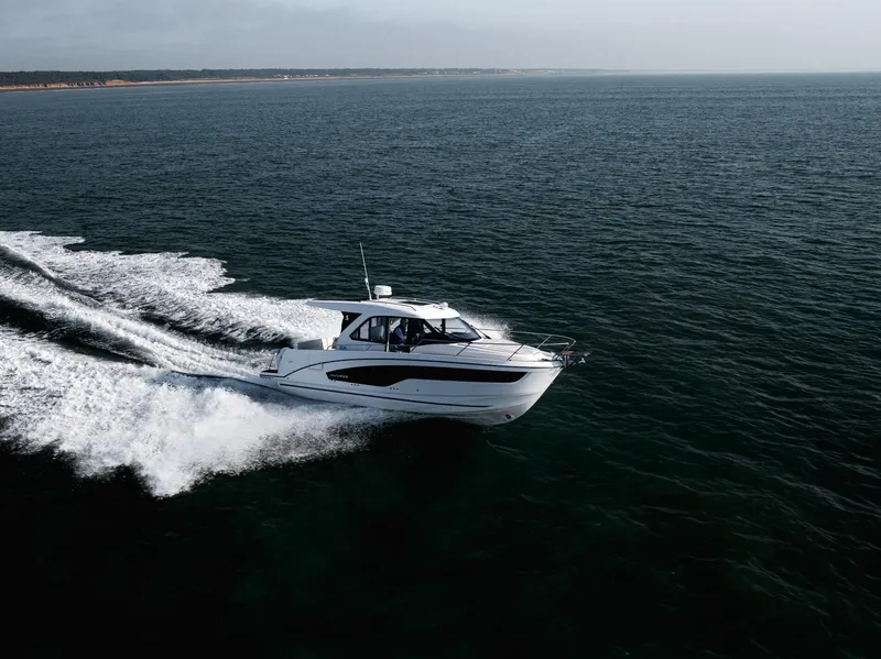 Slide: The Image of 2025 Beneteau Antares 9 cruising on open water, showcasing sleek design and performance. - 9