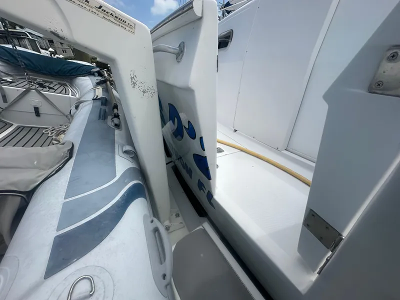 Slide: The Image of 1999 Mainship 430 Trawler deck with inflatable boat and storage compartment. - 15