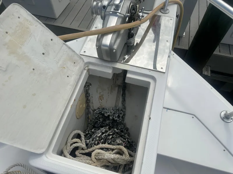 Slide: The Image of Anchor chain and rope storage on 1999 Mainship 430 Trawler boat deck. - 18