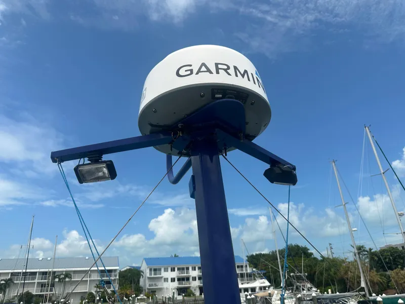 Slide: The Image of Garmin radar on 1999 Mainship 430 Trawler, marina background, clear sky. - 19