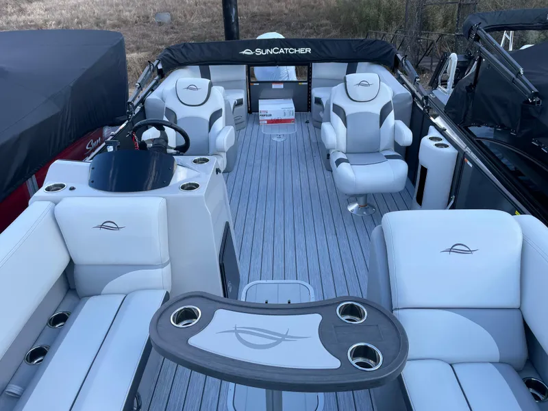 Slide: The Image of 2025 SunCatcher Select 322RC pontoon boat interior with luxurious seating and modern design. - 10