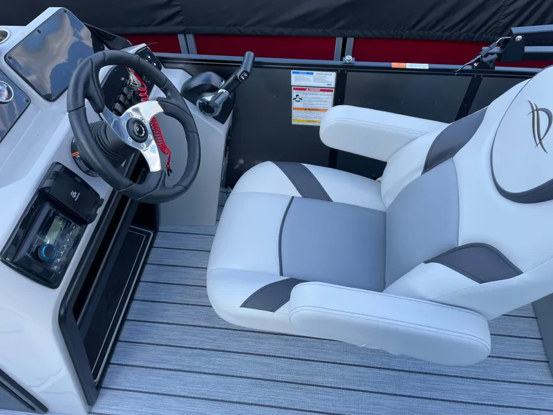 Slide: The Image of Captain's chair and helm of 2025 SunCatcher Select 322RC boat, featuring modern design. - 12