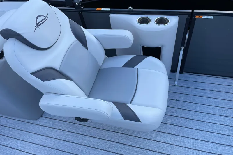 Slide: The Image of Luxurious seating on 2025 SunCatcher Select 322RC boat with cup holders and sleek design. - 13