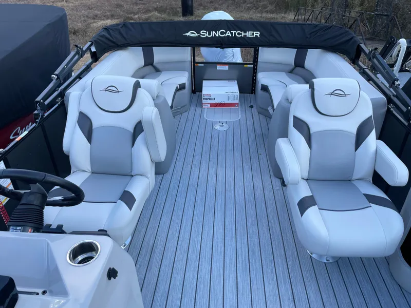 Slide: The Image of 2025 SunCatcher Select 322RC boat interior with plush seating and modern design. - 14