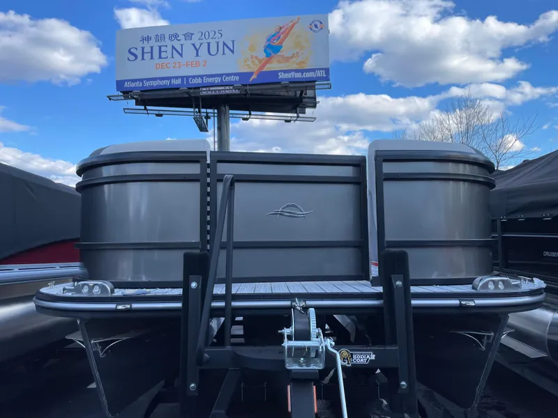Slide: The Image of 2025 SunCatcher Select 322RC pontoon boat with Shen Yun billboard in background. - 3