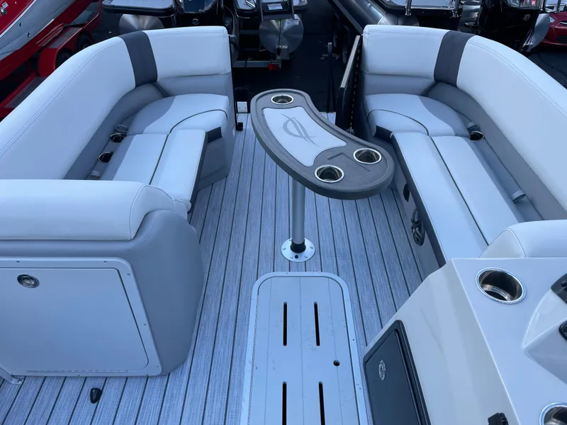 Slide: The Image of Luxurious 2025 SunCatcher Select 322RC boat interior with plush seating and modern table design. - 8