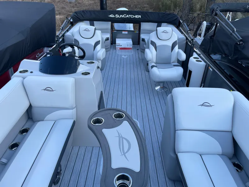 Slide: The Image of 2025 SunCatcher Select 322RC boat interior with luxurious seating and modern design. - 9