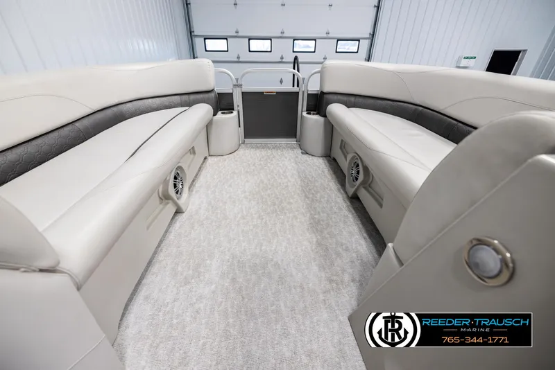 Slide: The Image of 2021 Avalon VLS QL boat interior with beige seating and carpet flooring. - 18