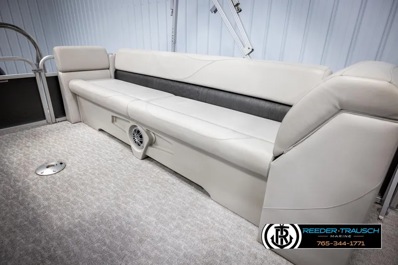Slide: The Image of 2021 Avalon VLS QL boat interior with beige seating and speaker. - 22