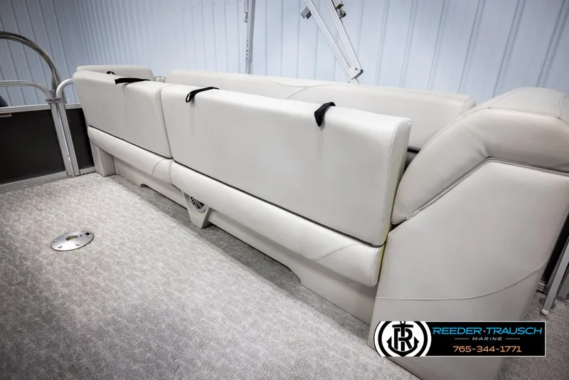 Slide: The Image of 2021 Avalon VLS QL boat interior with beige seating and carpeted flooring. - 23