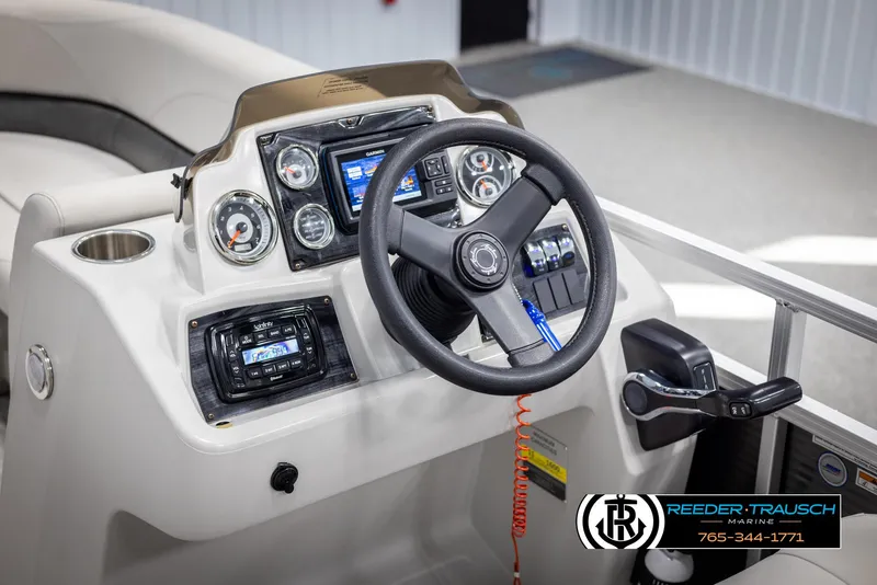 Slide: The Image of Steering console of 2021 Avalon VLS QL boat with gauges and controls, Reeder-Trausch Marine branding. - 25