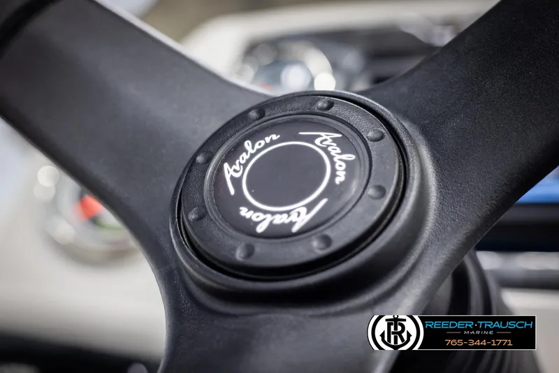 Slide: The Image of Steering wheel of 2021 Avalon VLS QL boat, featuring brand logo. - 26