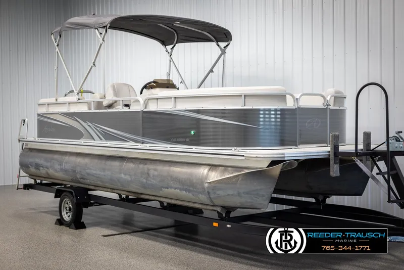 Slide: The Image of 2021 Avalon VLS QL pontoon boat on trailer in indoor showroom. - 3