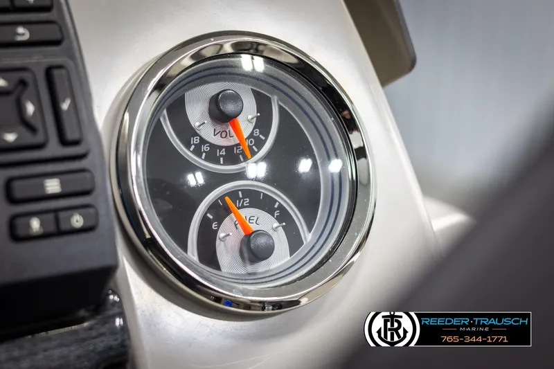 Slide: The Image of Dashboard gauges of 2021 Avalon VLS QL, featuring voltmeter and fuel gauge. - 31