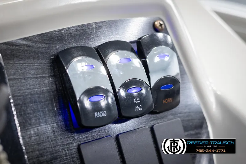 Slide: The Image of Control panel of 2021 Avalon VLS QL with radio, navigation, and horn switches. - 32