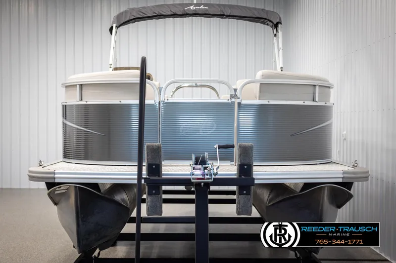 Slide: The Image of 2021 Avalon VLS QL pontoon boat on trailer in indoor storage. - 8