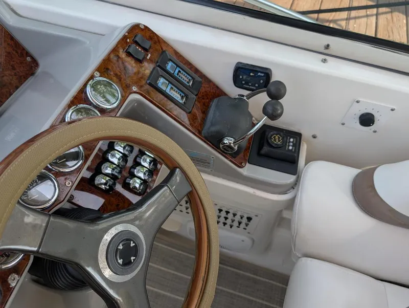 Slide: The Image of 2002 Formula 41 PC helm with steering wheel, controls, and gauges. - 11