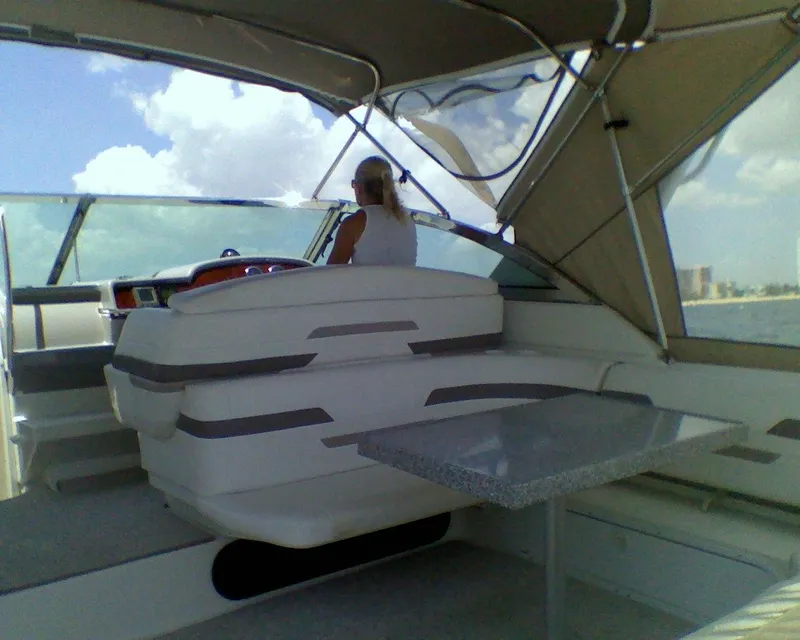 Slide: The Image of 2002 Formula 41 PC yacht interior with helm and seating area. - 12