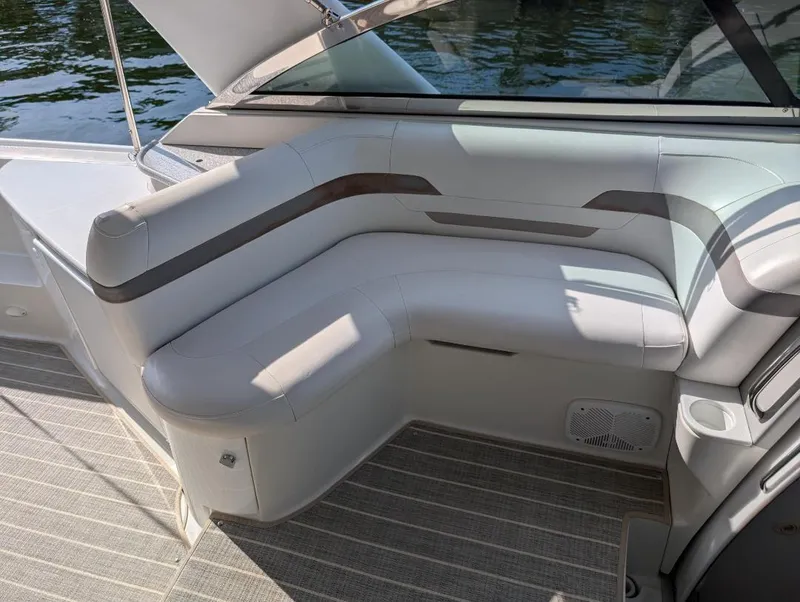 Slide: The Image of 2002 Formula 41 PC boat interior with white cushioned seating and sleek design. - 13