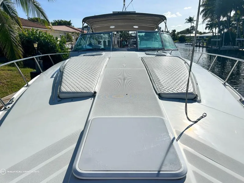 Slide: The Image of 2002 Formula 41 PC yacht on a sunny canal, featuring a spacious deck and luxurious seating. - 18