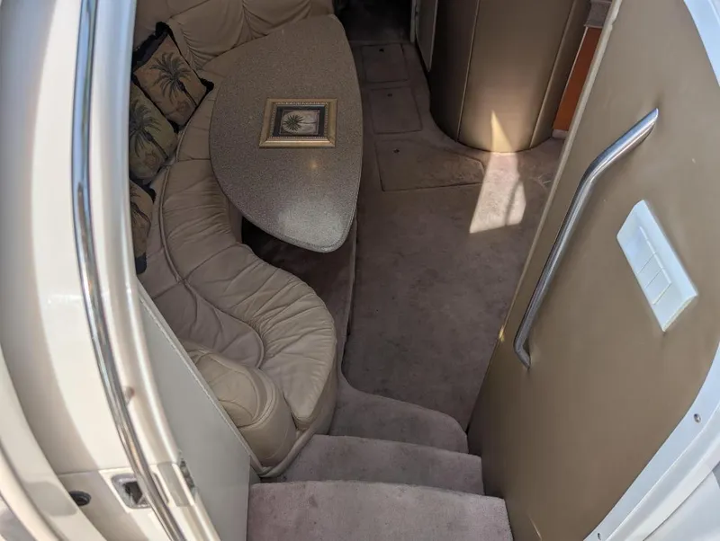 Slide: The Image of Interior of 2002 Formula 41 PC yacht with curved seating and table. - 19