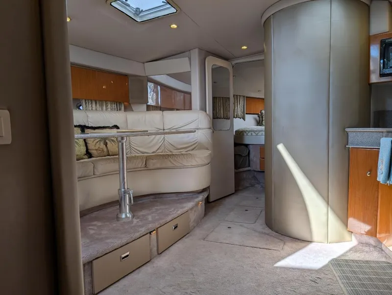Slide: The Image of Interior of a 2002 Formula 41 PC yacht, featuring a cozy seating area and modern design. - 23
