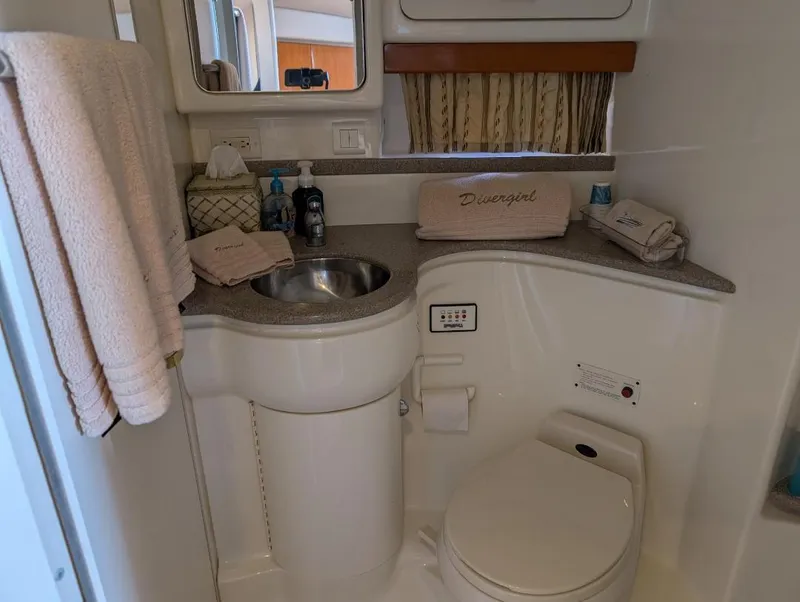 Slide: The Image of Bathroom interior of a 2002 Formula 41 PC yacht, featuring sink and toilet. - 28