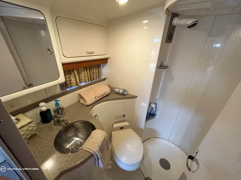 Slide: The Image of Luxurious bathroom in 2002 Formula 41 PC yacht with sink, toilet, and shower. - 29