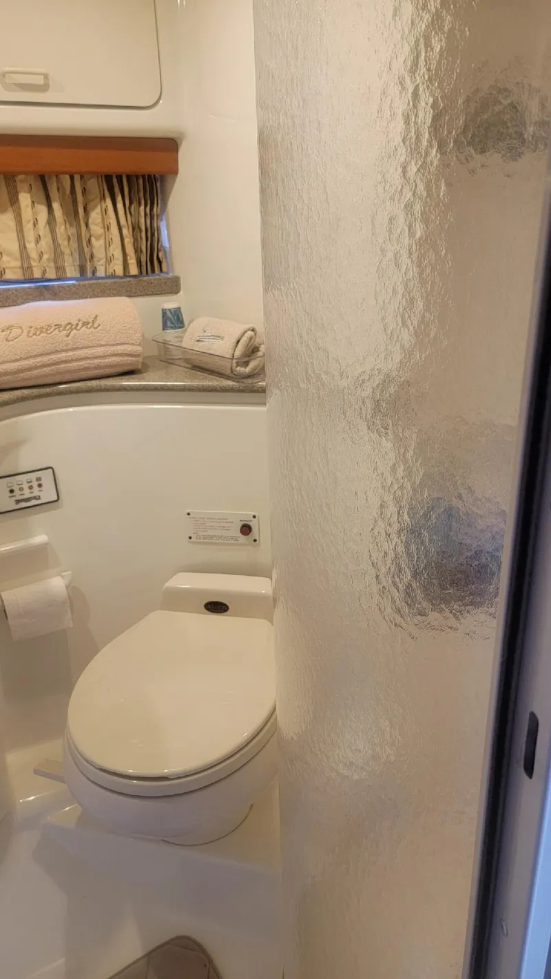 Slide: The Image of 2002 Formula 41 PC yacht bathroom with shower, toilet, and countertop. - 30