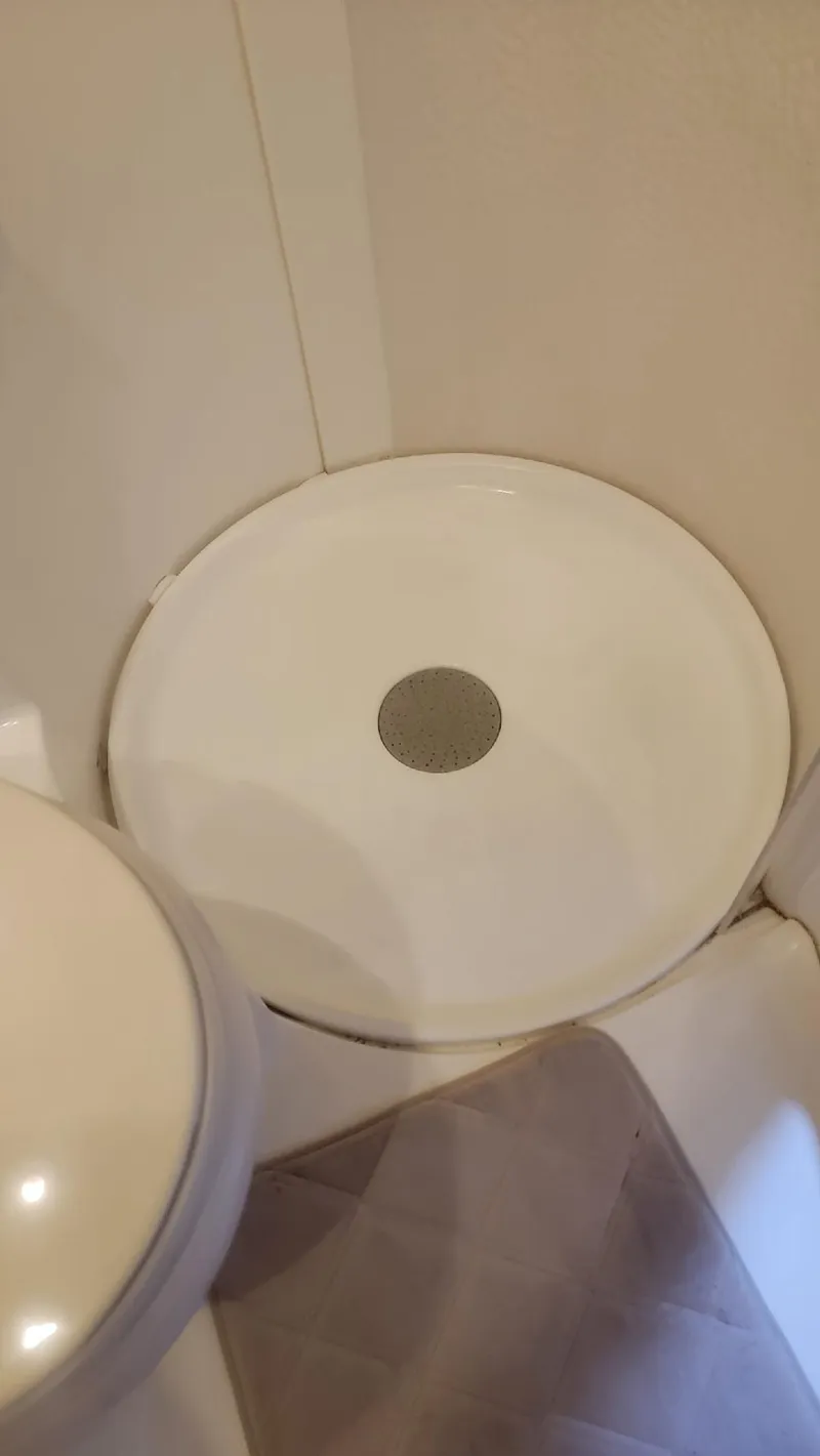 Slide: The Image of Circular shower base in a 2002 Formula 41 PC boat bathroom. - 31