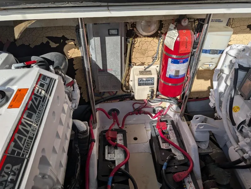 Slide: The Image of Engine compartment of a 2002 Formula 41 PC boat with batteries and fire extinguisher. - 34