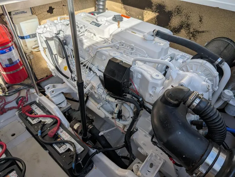 Slide: The Image of Engine compartment of a 2002 Formula 41 PC boat, featuring batteries and fire extinguisher. - 35