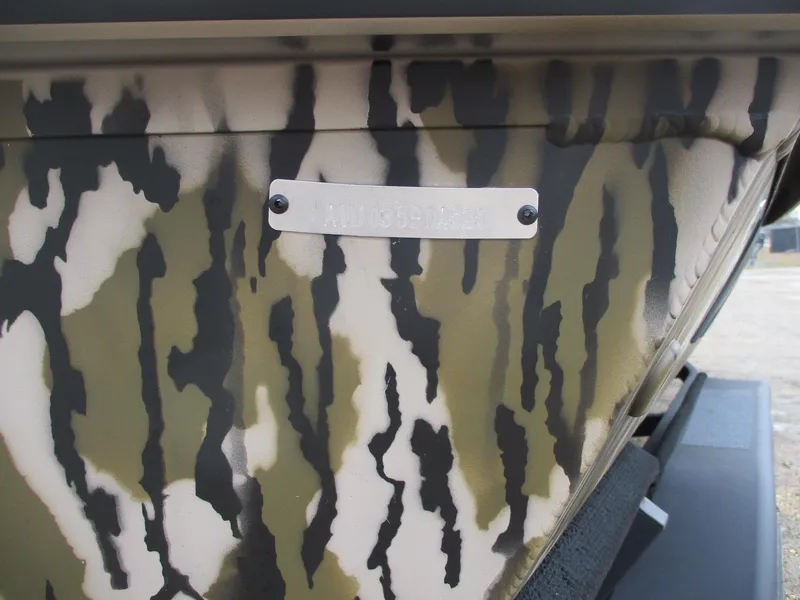 Slide: The Image of 2025 Avid 22 RECON CC boat with camouflage pattern detail. - 13