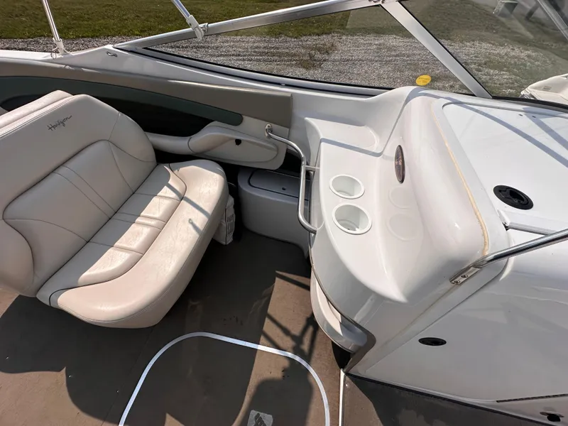Slide: The Image of Interior of 1999 Four Winns 240 Horizon boat with seating and cup holders. - 10