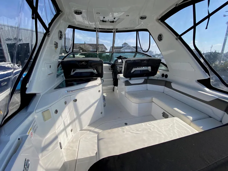 Slide: The Image of Interior of a 2015 Monterey 335 Sport Yacht, featuring sleek seating and modern design. - 24