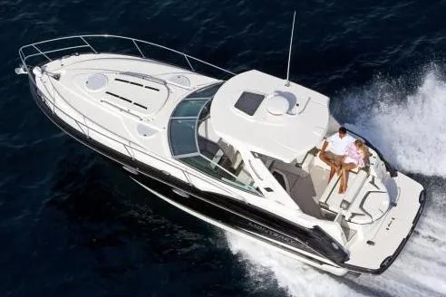 Slide: The Image of 2015 Monterey 335 Sport Yacht cruising on open water, aerial view. - 4