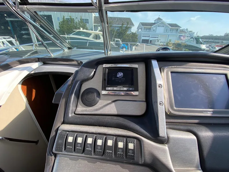Slide: The Image of Control panel of a 2015 Monterey 335 Sport Yacht with navigation and control systems. - 7