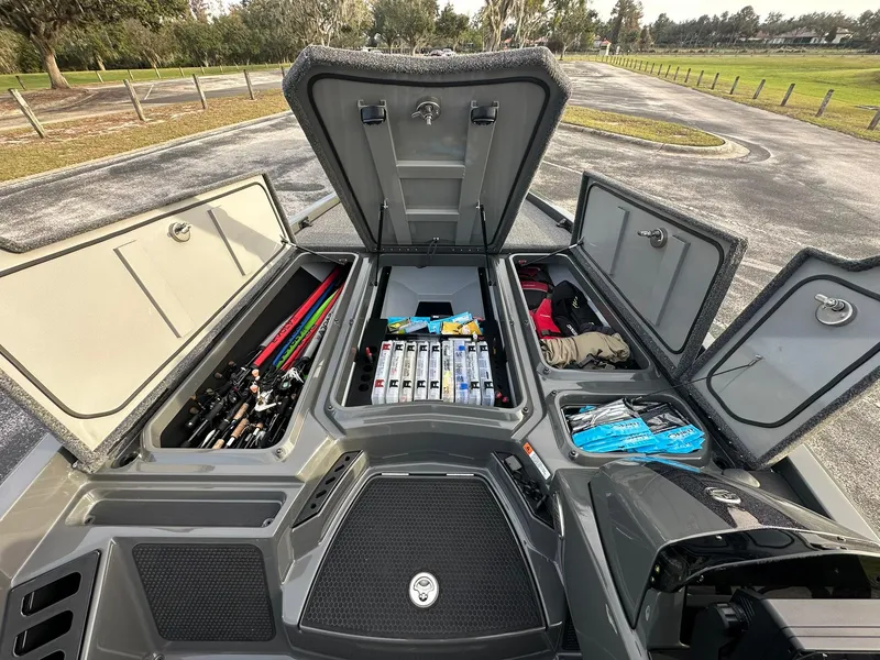 Slide: The Image of 2024 iKon LX21 boat storage compartments with fishing gear and accessories. - 1