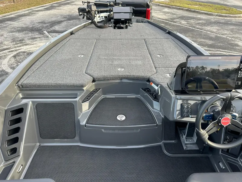 Slide: The Image of 2024 iKon LX21 boat interior with advanced dashboard and spacious deck. - 11