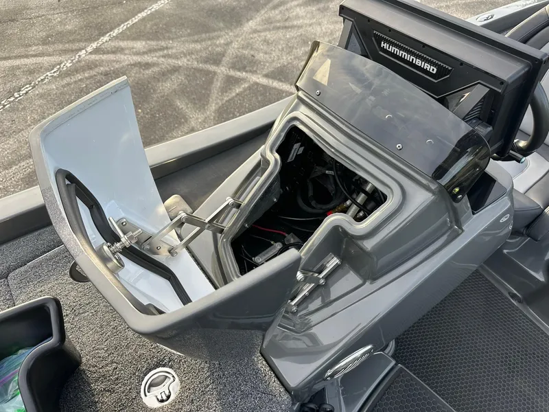 Slide: The Image of 2024 iKon LX21 boat console with open storage compartment and Humminbird electronics. - 3