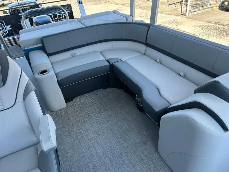 Slide: The Image of Luxurious seating on 2025 Avalon Catalina 2585 Funship Cruise boat, featuring sleek gray upholstery. - 6