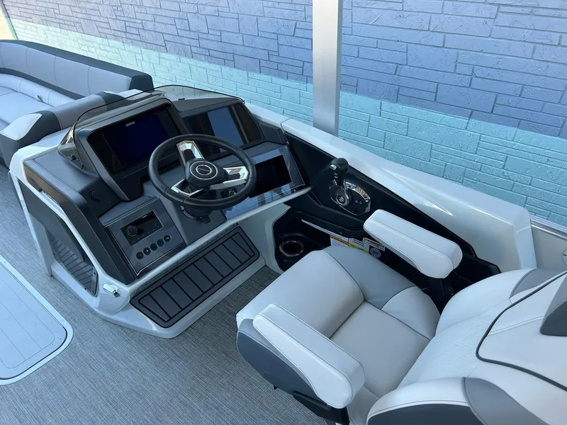 Slide: The Image of 2025 Avalon Catalina 2585 Funship Cruise helm with modern controls and comfortable seating. - 8