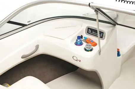 Slide: The Image of 2012 Tahoe Q4 SS boat interior with dashboard and storage compartments. - 14