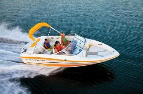 Slide: The Image of 2012 Tahoe Q4 SS speedboat cruising on open water with passengers. - 18
