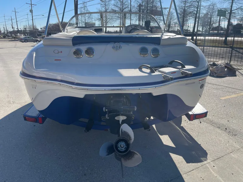 Slide: The Image of 2012 Tahoe Q4 SS boat, rear view, parked on a sunny day. - 4